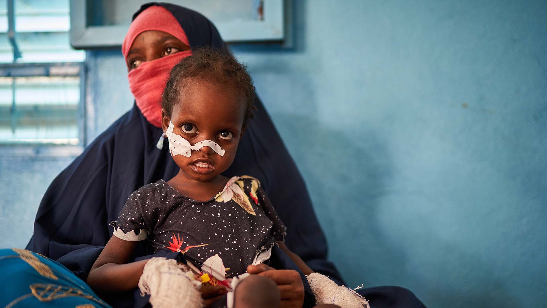 Achta with her mother at an Action Against Hunger nutrition unit in Chad.