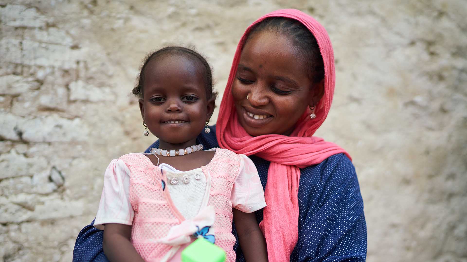 A portrait of Achta with her mother Koubra. Action Against Hunger in Chad helped Achta to recover from malnutrition.