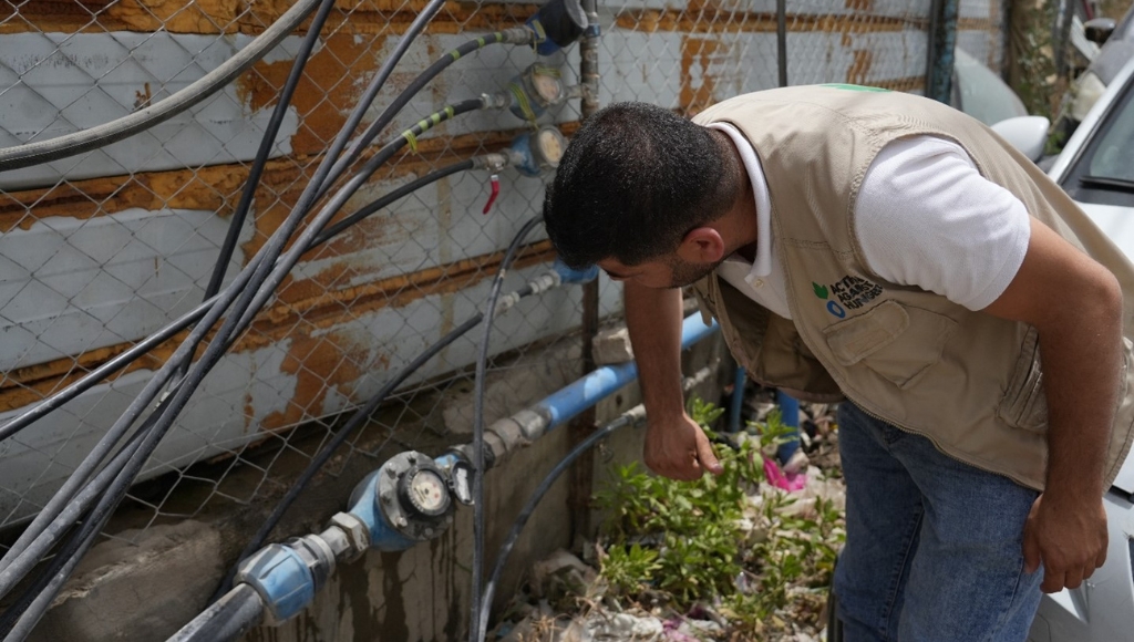 Action Against Hunger aid worker in Gaza working on water supply.