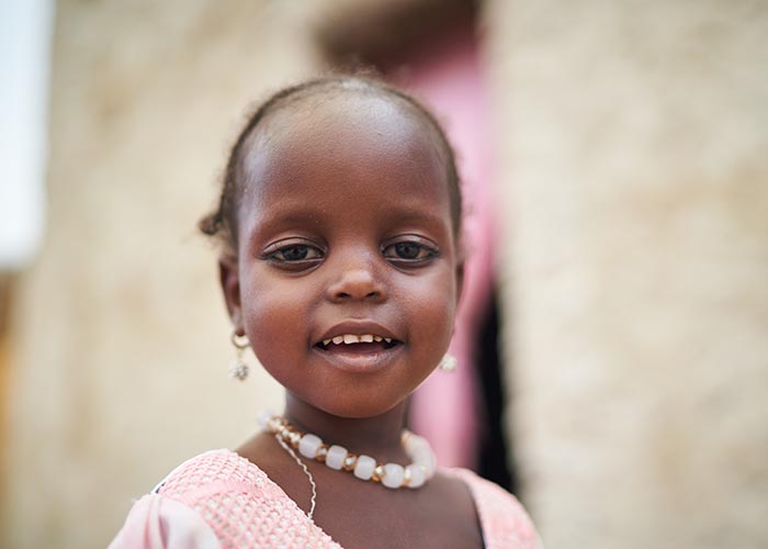 Portrait of Achta from Chad. Action Against Hunger helped her to recover from malnutrition.