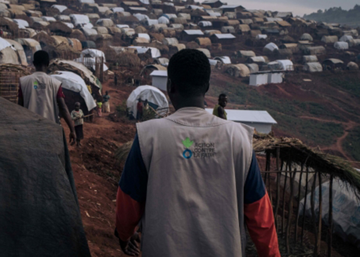 Photo of an Action Against Hunger staff member walking in the Democratic Republic of Congo.