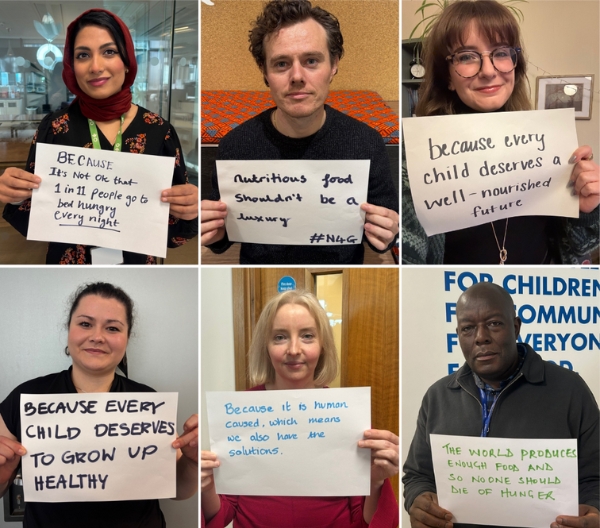 Action Against Hunger staff holding up signs on why they care about world hunger.